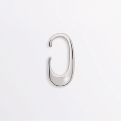 Earcuff Clip made of brass with a sleek, polished curve design for minimalist elegance.