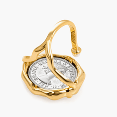 Ring Coiné featuring a gold-plated brass design with intricate coin detail and a fluid frame, accented with a pearl.