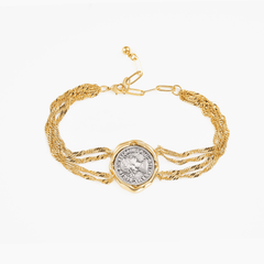 Bracelet Coiné featuring a vintage coin in a bold gold frame with a double gold chain for a timeless look.