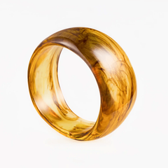 Bracelet Solar made of plastic with smooth golden amber hues, showcasing bold elegance and modern sophistication.