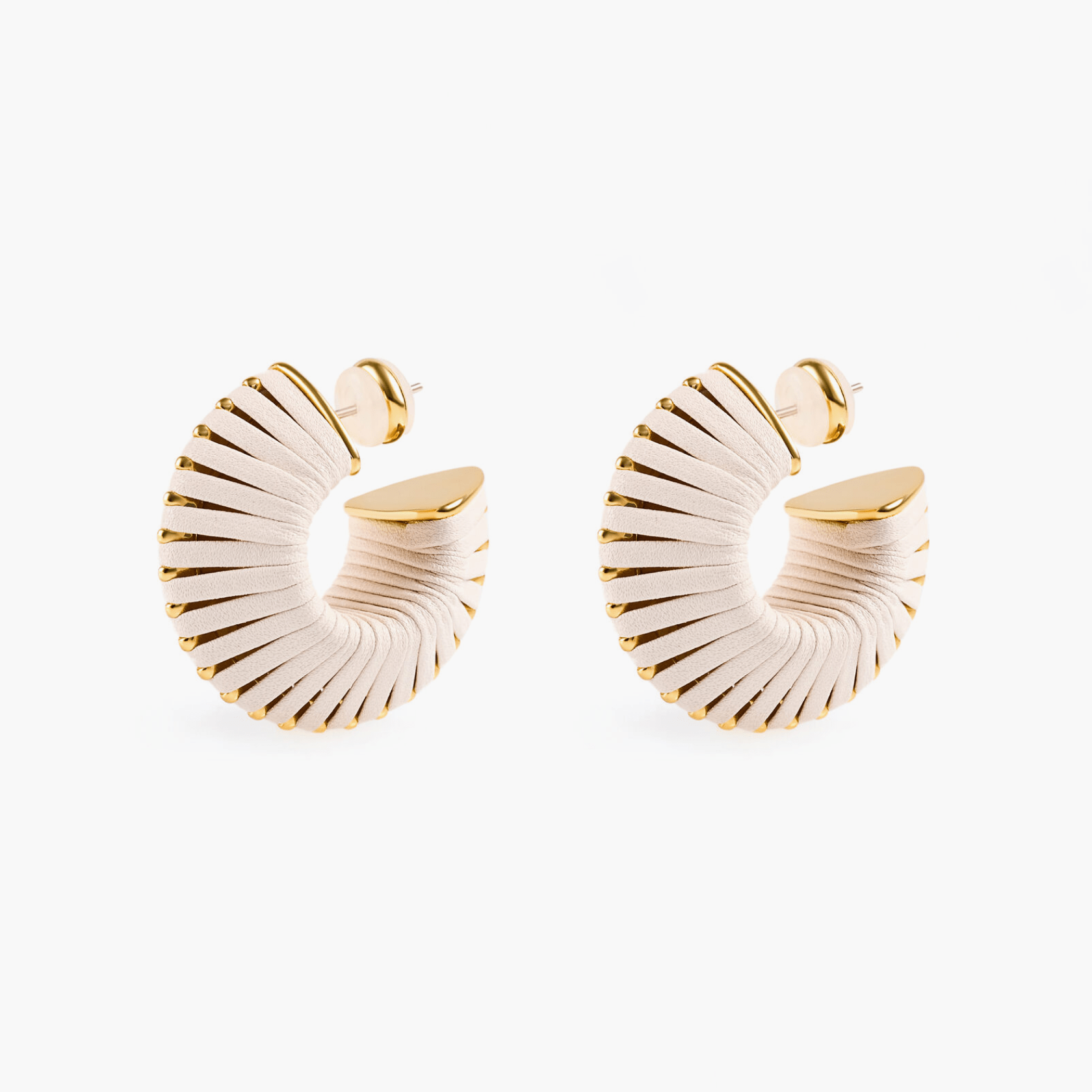 Earrings Arc featuring textured faux leather and 18k gold plating, showcasing a modern design inspired by nature.