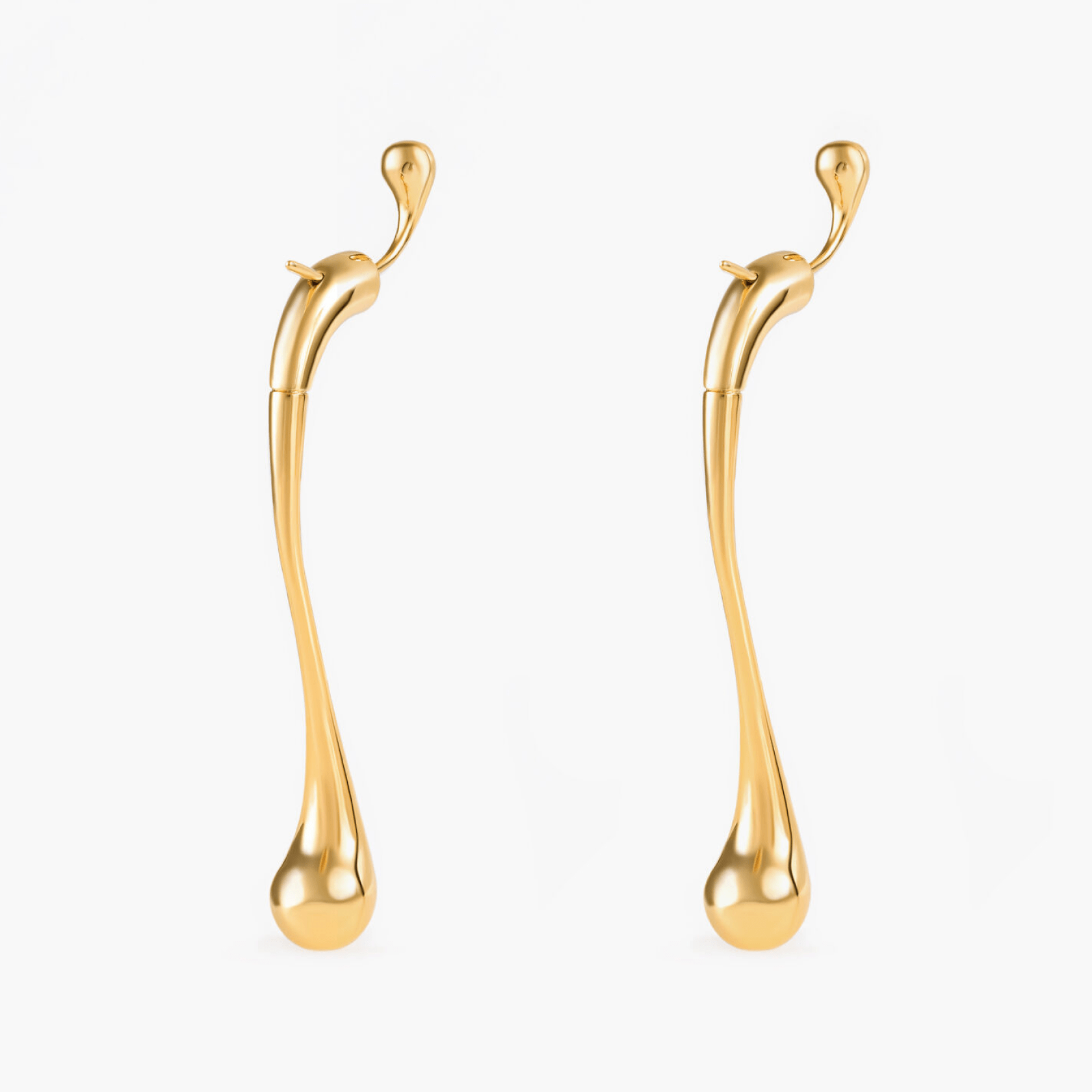Earrings Drip in gold-plated brass with a modern elongated shape, reflecting elegance and grace.