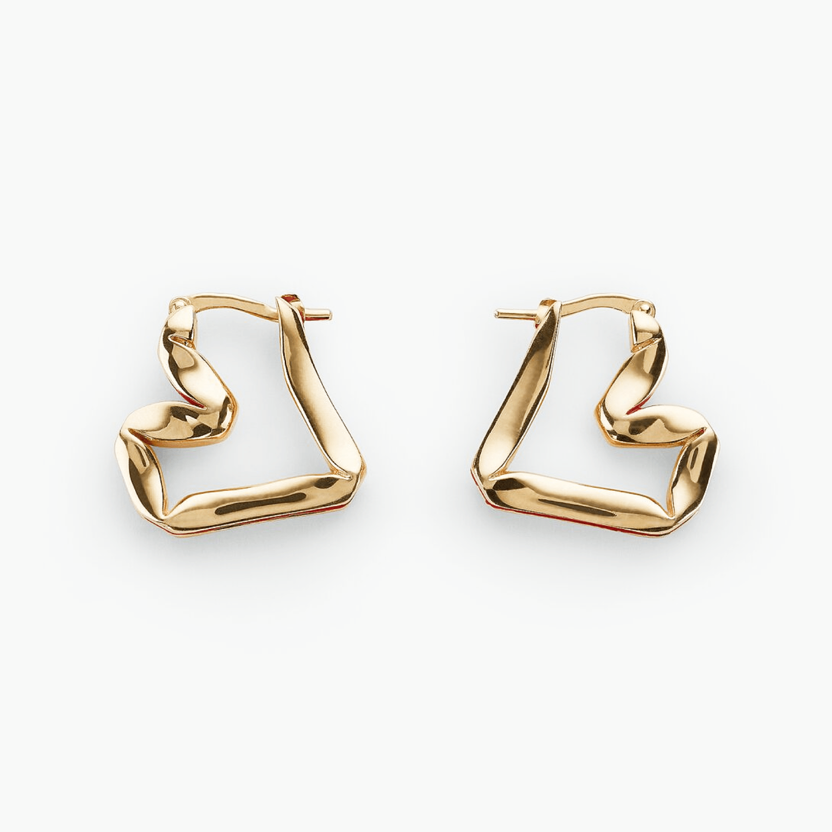 Earrings Sway features sculptural gold-plated brass design embodying fluid motion and elegance.