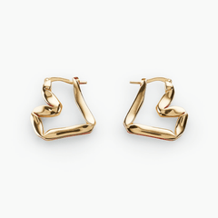 Earrings Sway features sculptural gold-plated brass design embodying fluid motion and elegance.