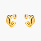 Earrings Twist made of brass and 18K gold-plated material, showcasing elegant interwoven design.