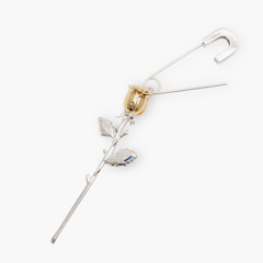 Earrings Bloom featuring a gold-plated rose on a sleek safety pin design, symbolizing strength and elegance.