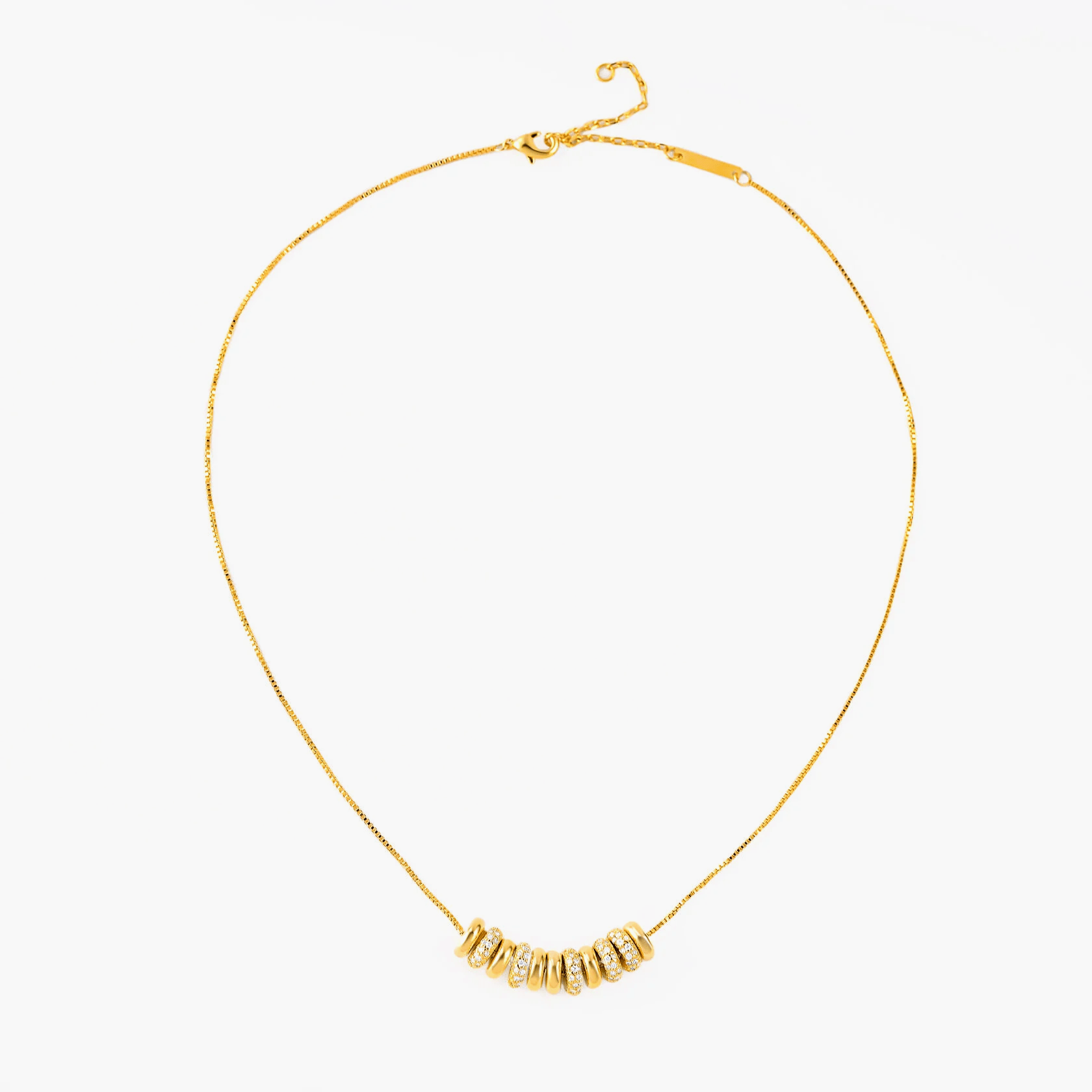 Necklace Cascade featuring elegant gold-plated rings on a sleek chain, perfect for everyday or special occasions.