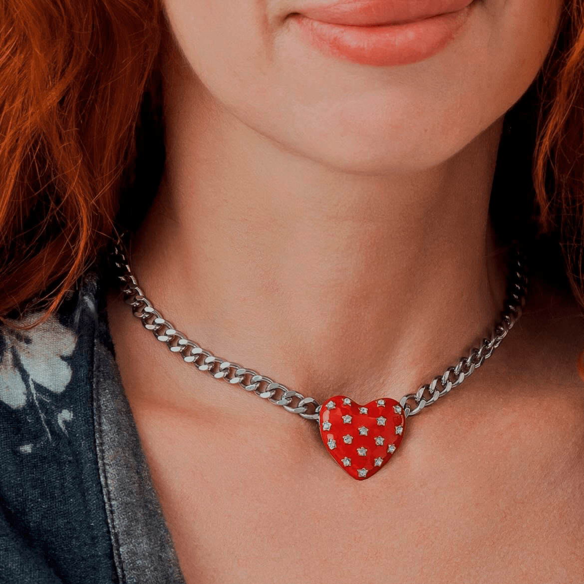 Necklace Red Heart featuring a red heart pendant with star-shaped studs on a chunky silver chain.