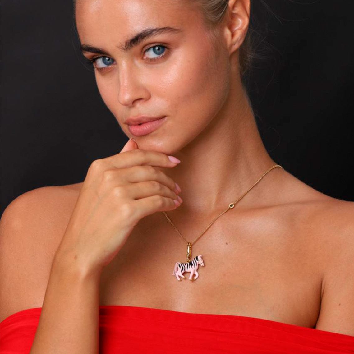 Necklace Zebra worn by a model, showcasing playful pink and gold design, perfect pop-art jewelry piece.