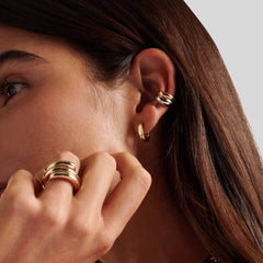 Earcuff Dual showcasing bold brass jewelry with polished gold and mirror-finish silver, perfect for modern styling.