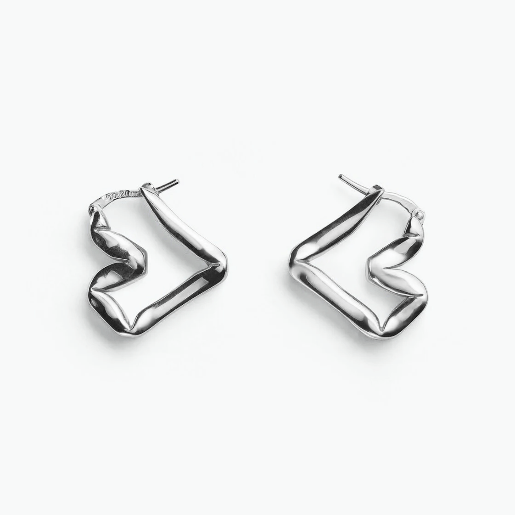 Earrings Sway, sculptural gold-plated earrings showcasing fluid motion and geometric curves.