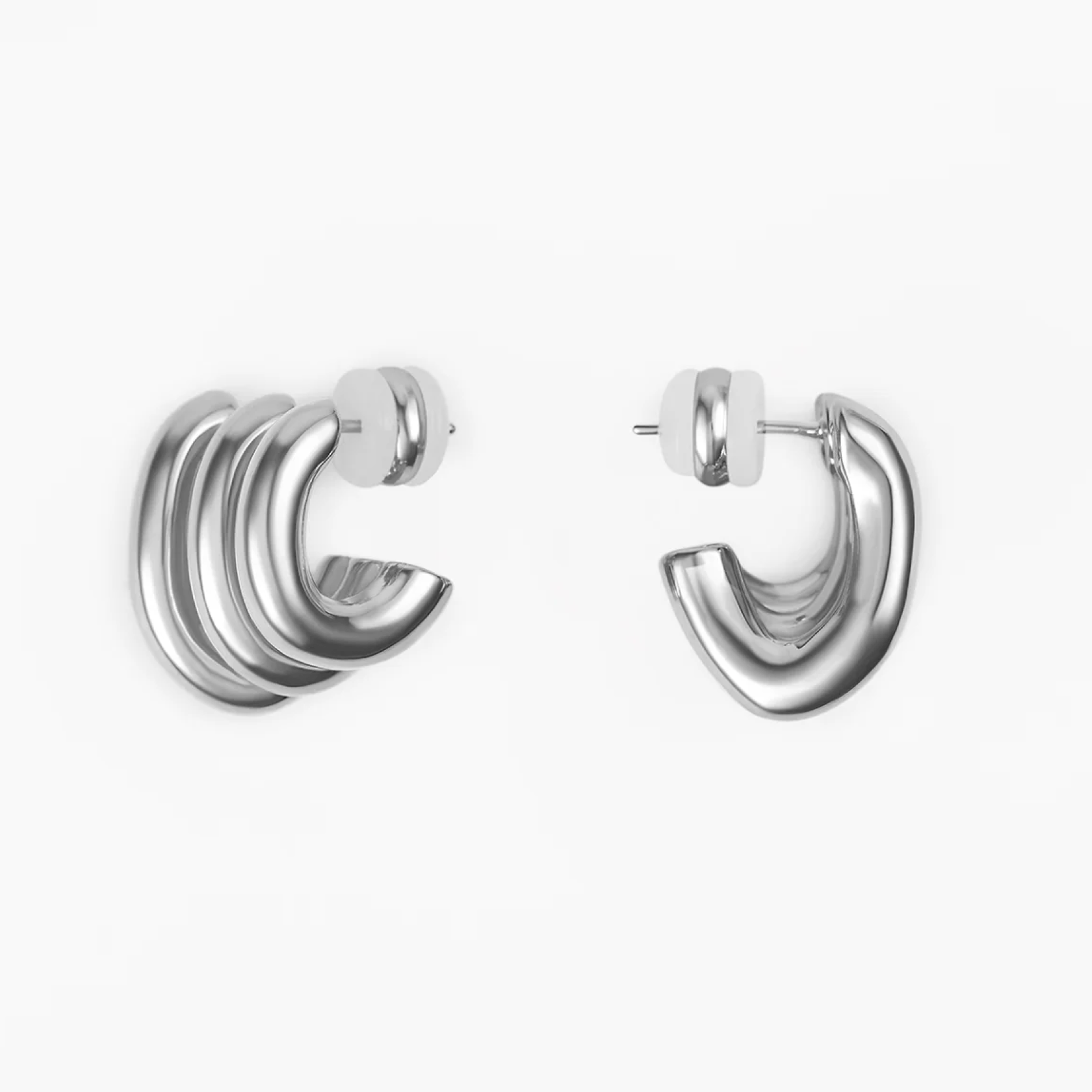 Earrings Twist in polished silver, showcasing elegant craftsmanship and modern design, perfect for any occasion.
