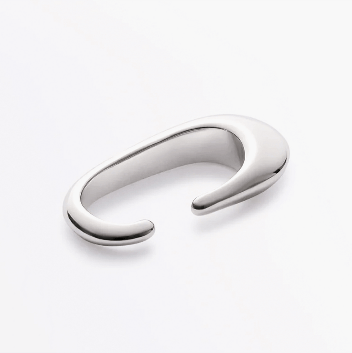 Earcuff Clip made of brass with a polished finish, showcasing minimalist design and fluid strength.