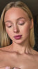 Close-up of a woman with blonde hair showing natural makeup, ideal for showcasing Earrings Flux.