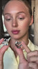 Model showcasing the Earrings Sway, unique sculptural designs with a bold aesthetic.